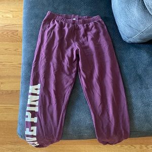Purple Pink Sweatpants that say “love pink” on the right leg. Size S